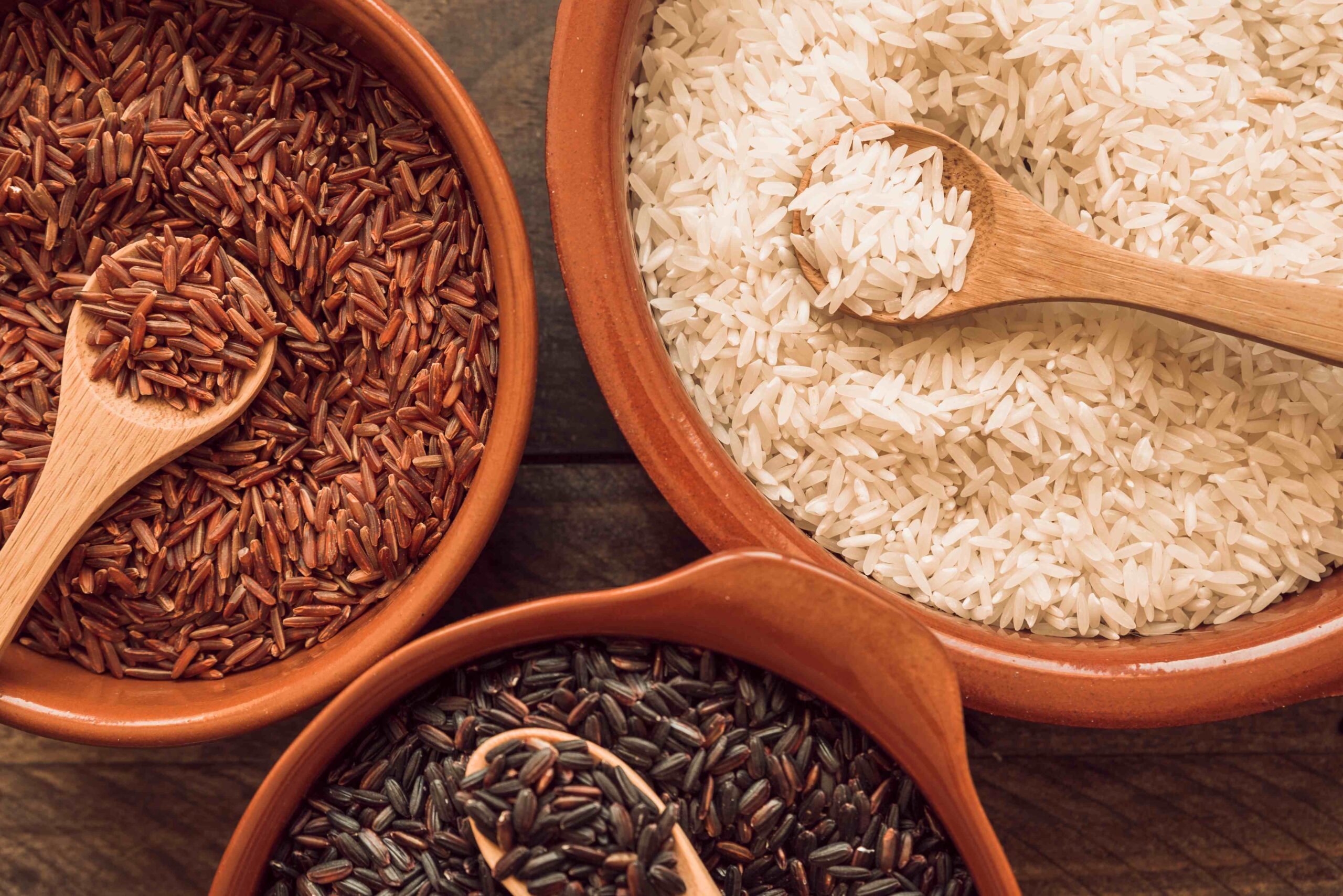 overhead-view-organic-rice-grains-with-wooden-spoon1